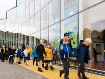 Schoolchildren walking past science centre