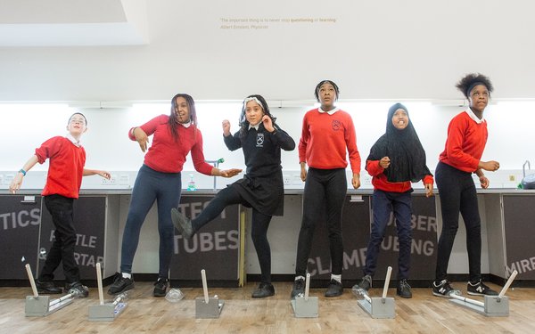 Pupils taking part in science experiment